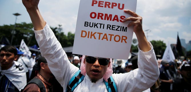 A man protesting against the government’s new power to ban organisations deemed anti-Pancasila, Indonesia’s state ideology. Photo: Reuters/Beawiharta