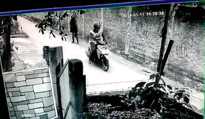 CCTV footage showing moments after a motorcyclist groped a woman’s breast in Depok, Indonesia on January 11, 2017. 