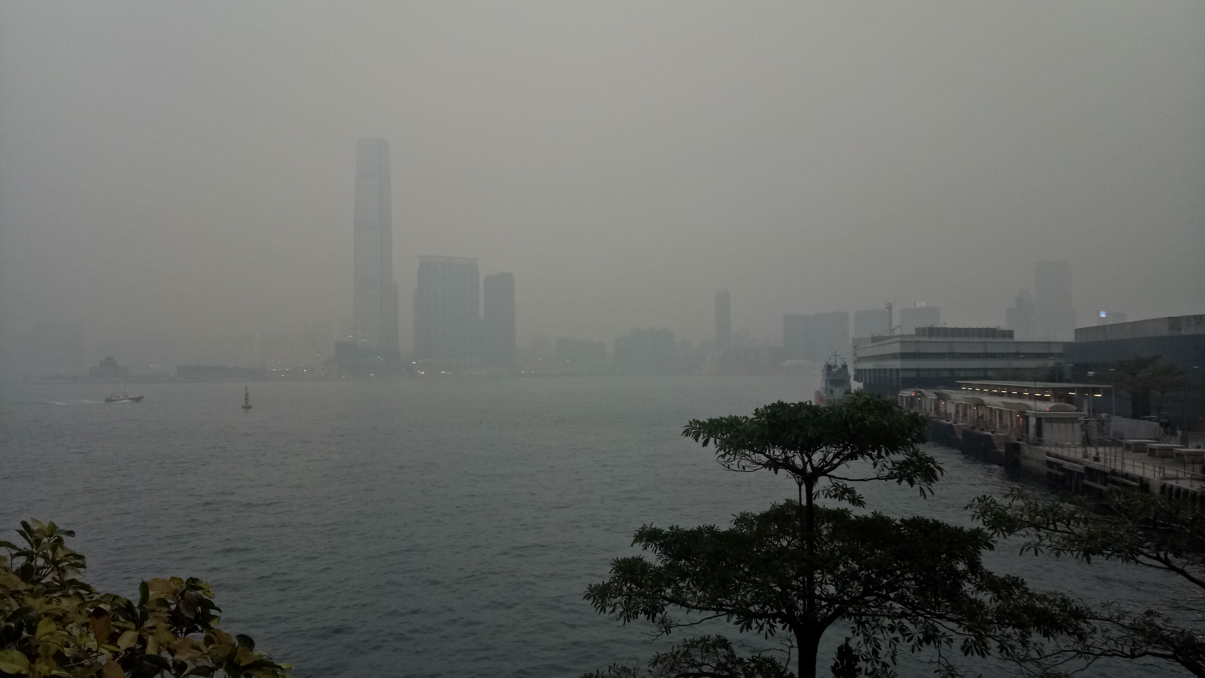 Looking across Victoria Harbour toward the smog-shrouded ICC building on Monday, Jan 22 