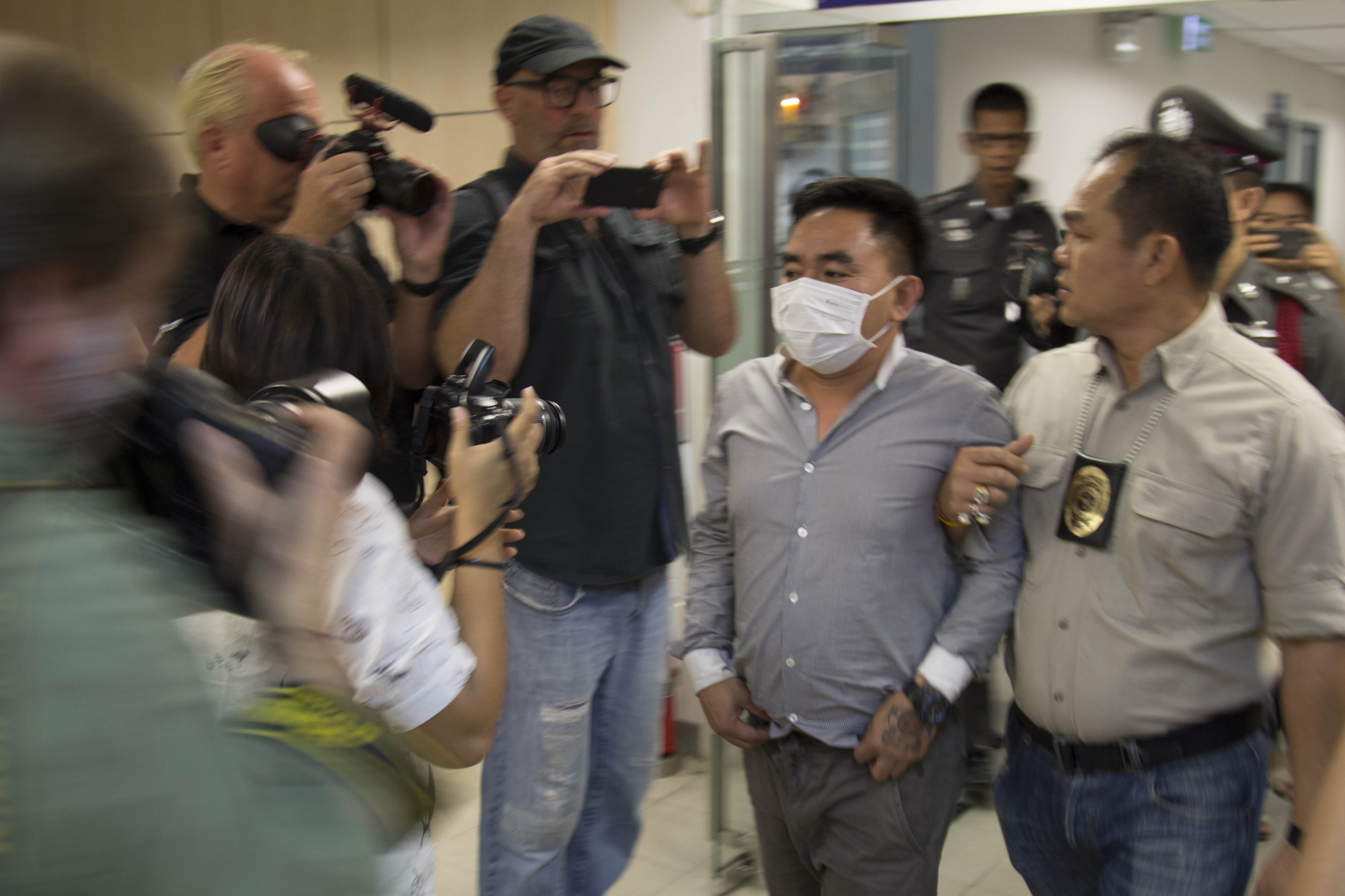 Wildlife trafficking kingpin Insert name sits in handcuffs after being arrested on conspiracy to traffic charges in Bangkok.
Photo: Freeland/Matthew P