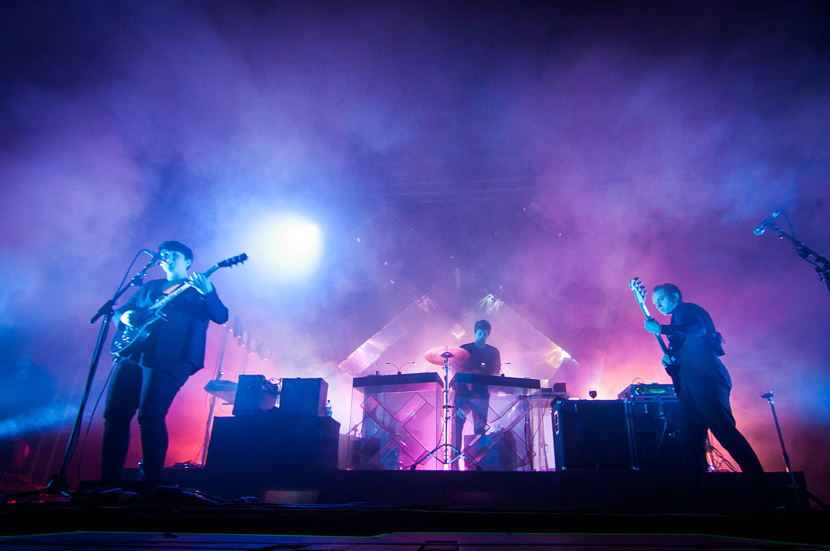 The xx performing at Ilosaarirock Festival in Joensuu, Finland, in 2012. Left to right: Romy Madley Croft, Jamie xx, Oliver Sim.