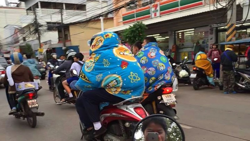 Thai motorcyclists wrap themselves in blankets on a cooler day. Photo: Facebook