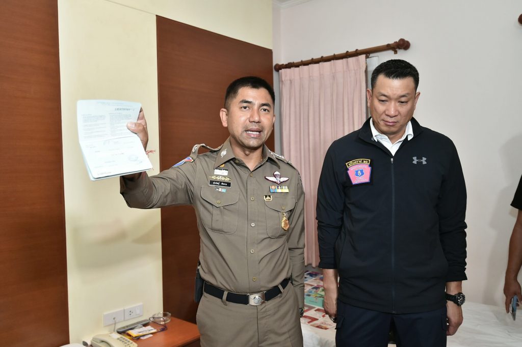 Tourist Police Bureau deputy commissioner Pol. Maj. Gen. Surachet Hakparn (left) is photographed at a recent raid in Huai Khwang area. Photo: Tourist Police 