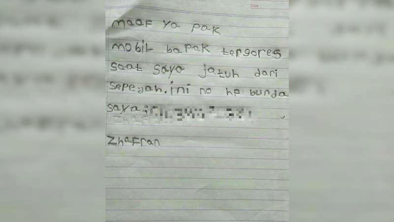 A handwritten apology note by a 6-year-old Indonesian boy after his bike scratched a parked car. Photo: Instagram