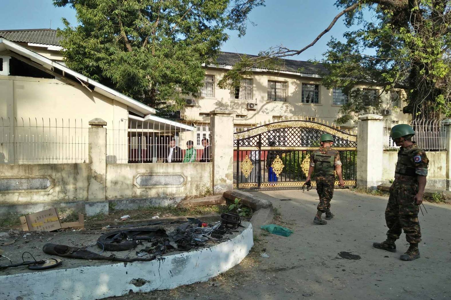 Myanmar security personnel inspect the aftermath of one of three bombings in Sittwe on Feb. 24, 2018. Photo: Office of the Commander-in-Chief