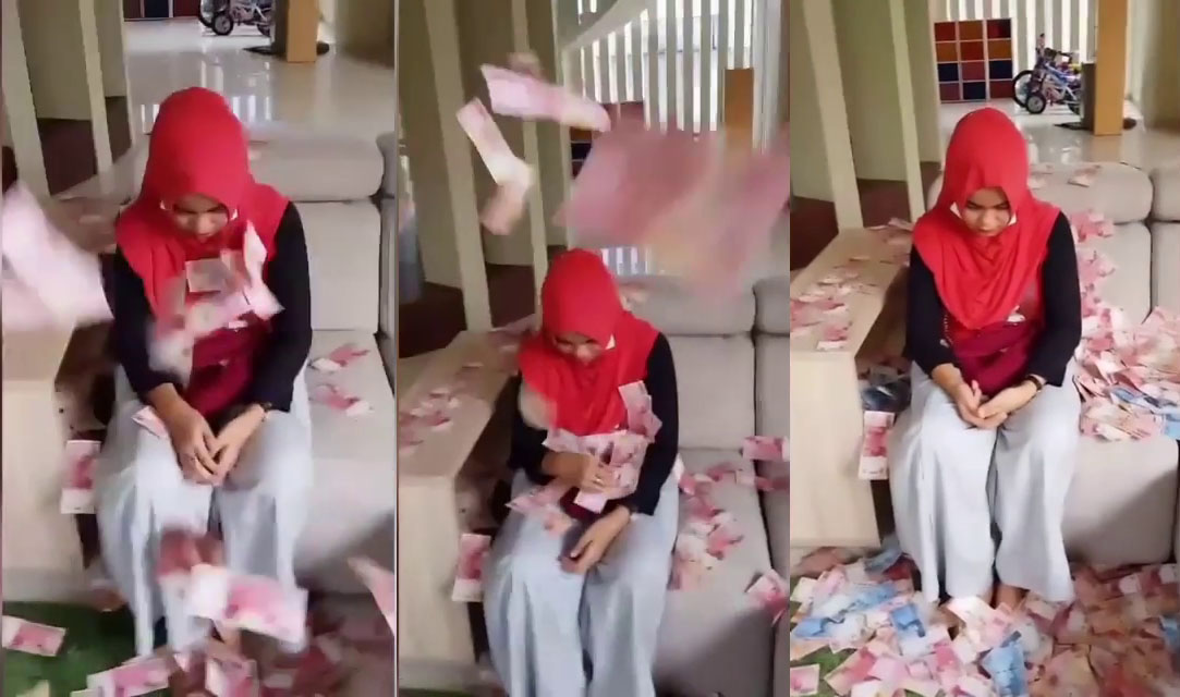 In Indonesia, a video recently went viral showing a woman being showered with cash as a form of shaming for allegedly cheating with friend’s husband. The friend, popularly known as Bu Dendy, accused the woman of trying to steal her husband for his money. Photo: Video screengrab