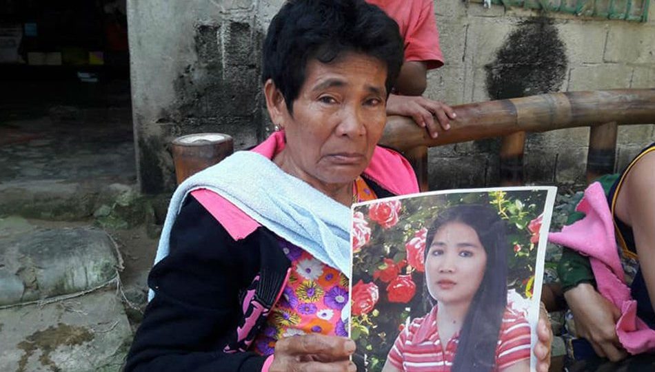 Demafelis’ mother Eva holds up a photo of her slain daughter. PHOTO: Regi Adosto, ABS-CBN News