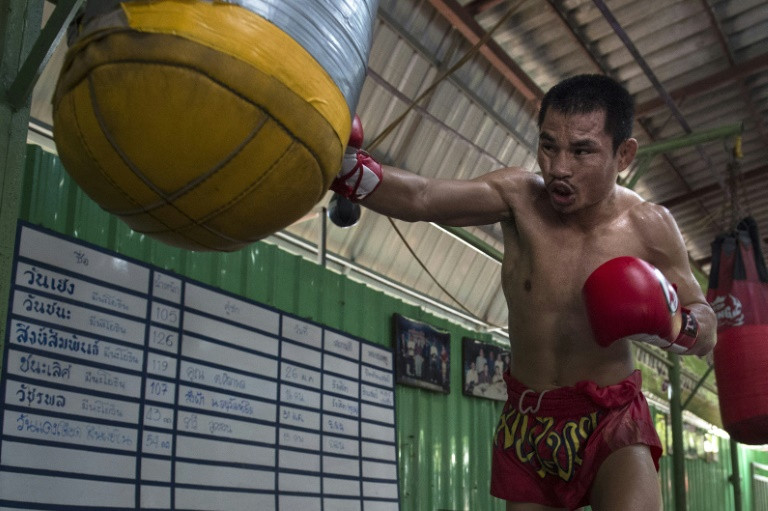 This photo taken on Jan. 31, 2018 shows the current World Boxing Council (WBC) mini-flyweight champion, Wanheng Menayothin, punching a bag during a training session in Bangkok. Photo: Lillian Suwanrumpha/ AFP