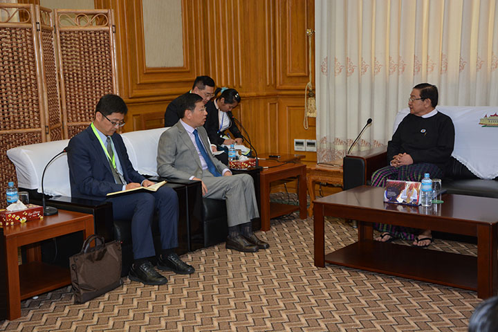 Then-deputy lower house speaker T Khun Myat meets the Chinese ambassador Hong Liang in Naypyidaw in July 2017. Photo: MOI