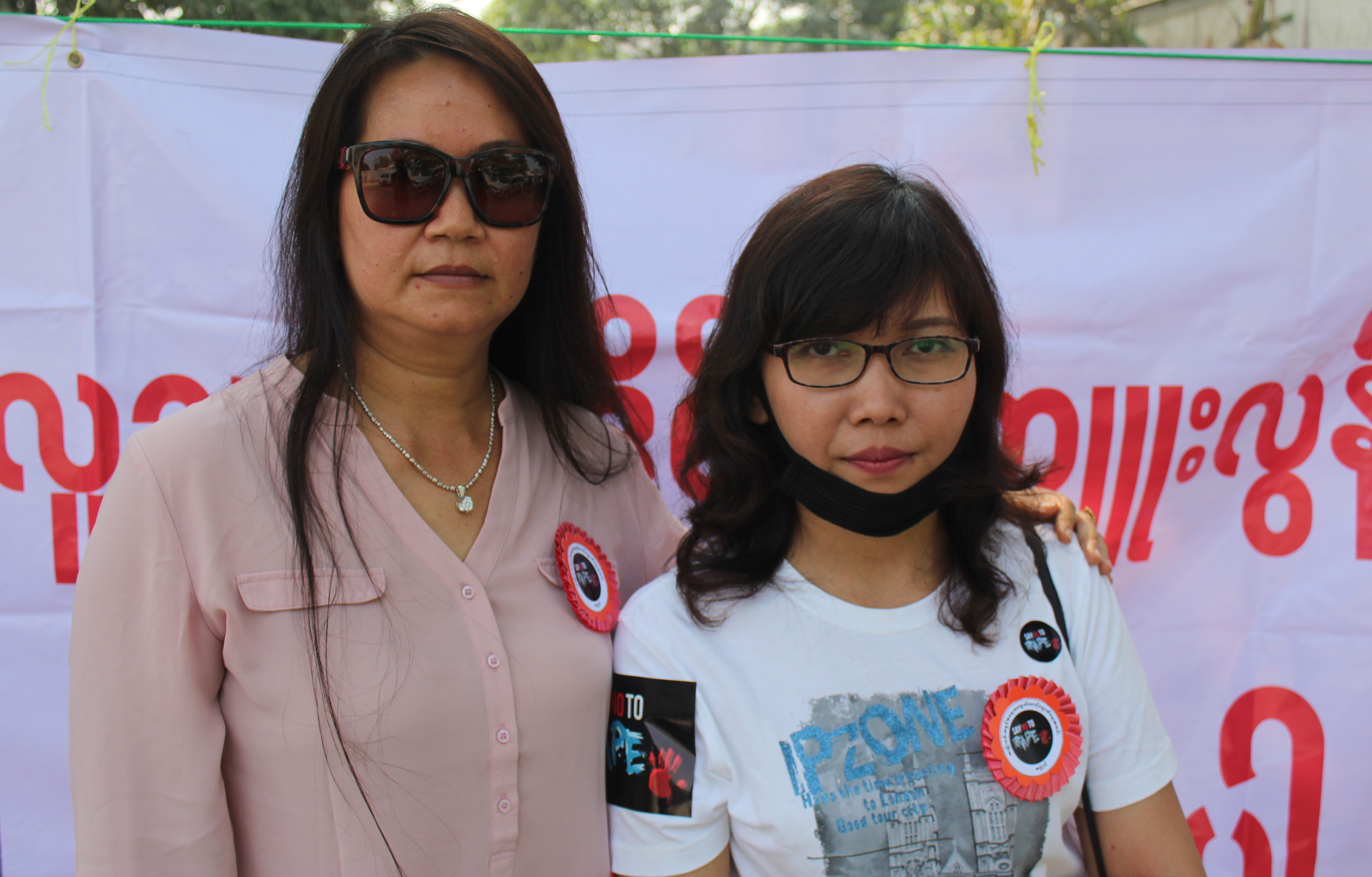 Women’s Defense Association members Thin Thanda (L) and Hnin Yee Aye attend a protest outside a Yangon courthouse on Feb. 22, 2018. Photo: Jacob Goldberg