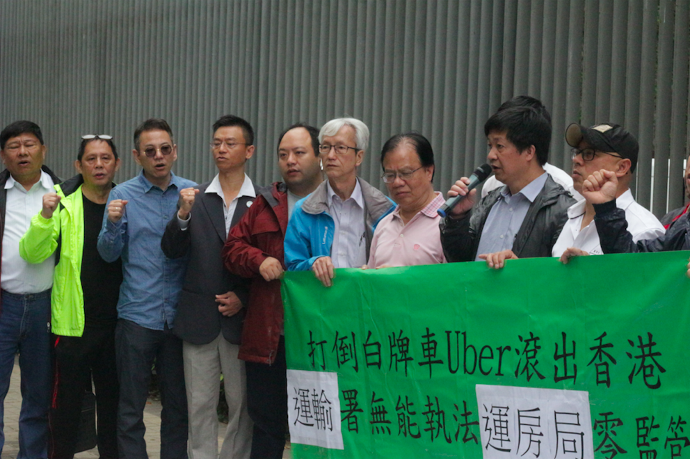 An alliance of taxi drivers chanting “down with Uber”. Photo by Vicky Wong.