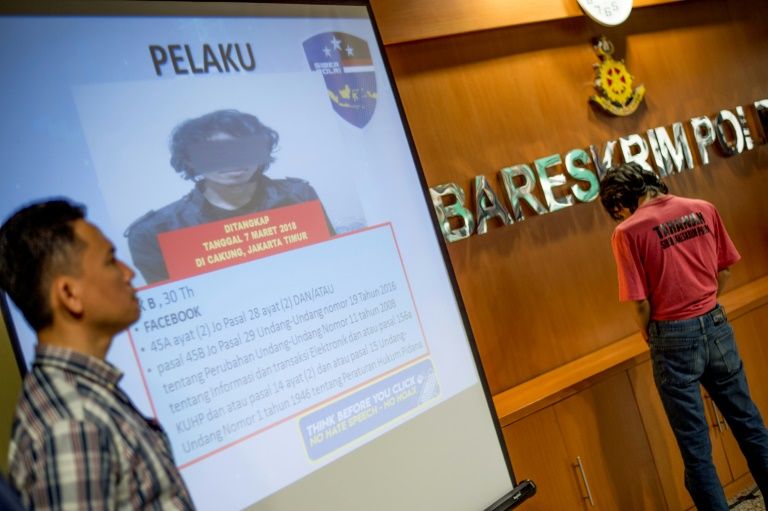 This photograph taken on March 8, 2018 shows Indonesian cyber crime police displaying a suspect accused of spreading fake news and online hate speech, in Jakarta. Indonesia is battling a wave of fake news and online hate speech ahead of presidential elections in 2019, as a string of arrests underscore fears it could crack open social and religious fault lines in the world’s largest Muslim-majority country.
BAY ISMOYO / AFP