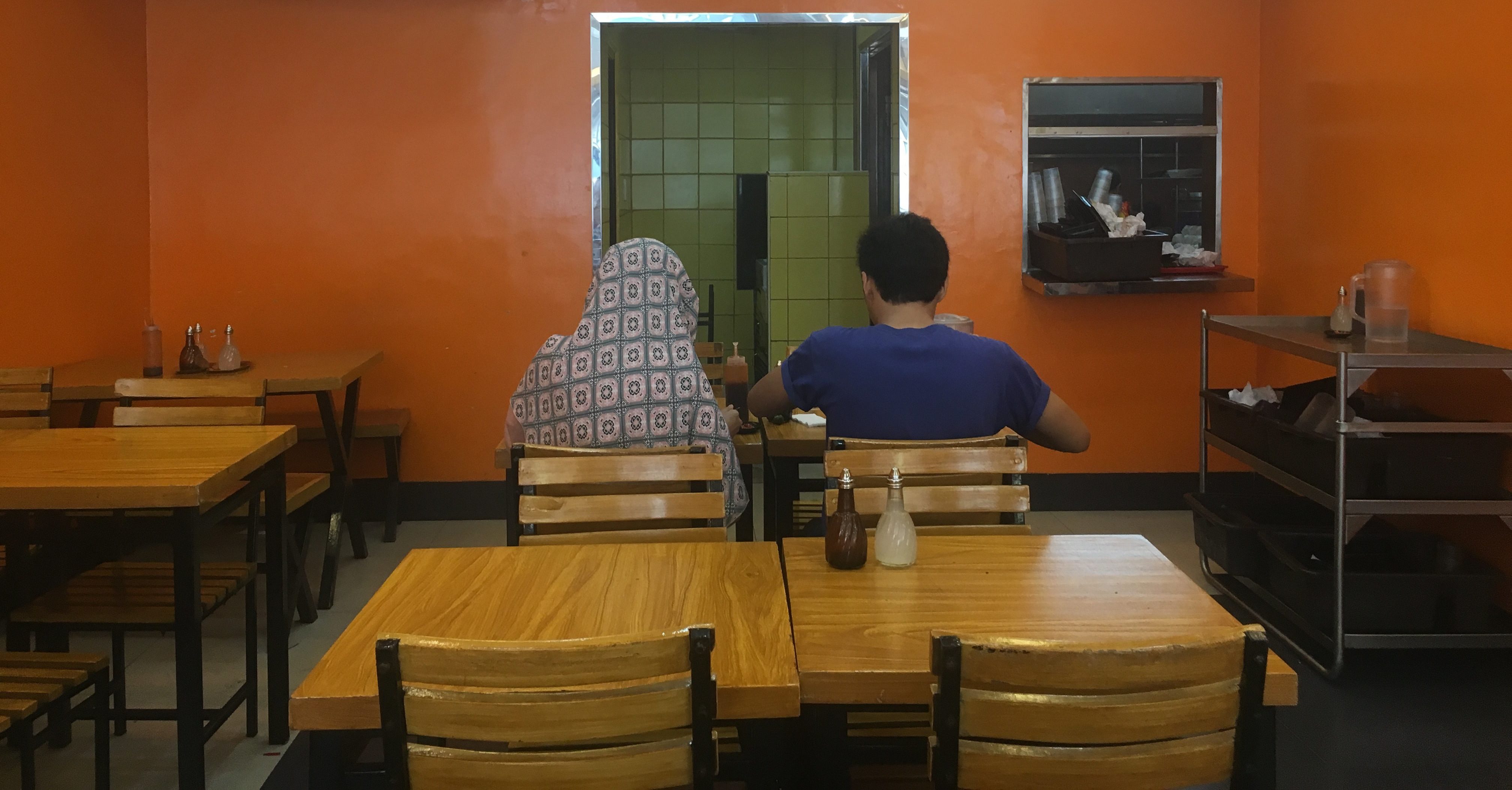 Nurrol Izzah Mala and Mohammed Gandamra in Iza’s Chicken Corner, a popular halal restaurant in Quiapo, Mania. (Photo by Therese Reyes)