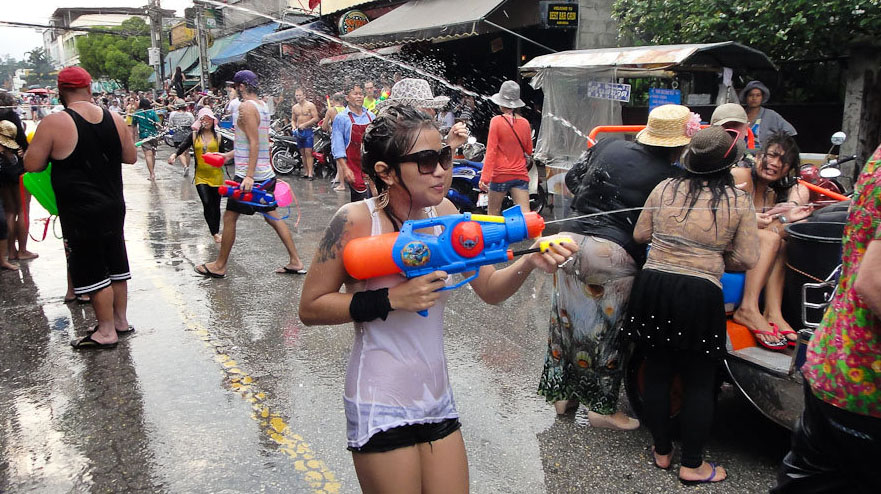 A file photo of a woman participating in a water fight during Songkran Festival, April 2012. Photo: John Shedrick
