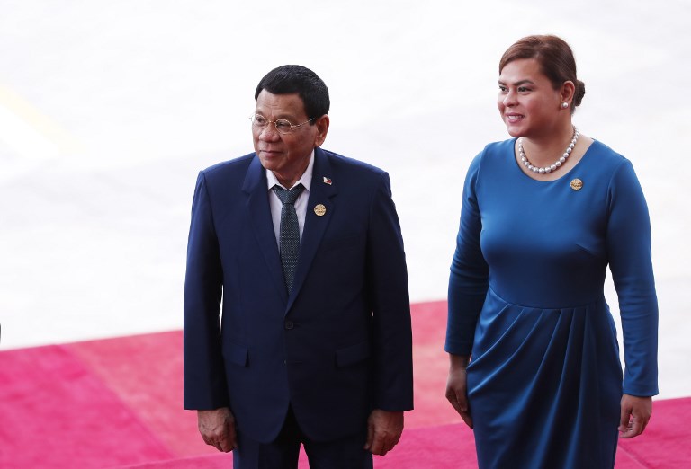 Philippine President Rodrigo Duterte (L) and his daughter Sara Duterte arrive for the opening of the Boao Forum for Asia (BFA) Annual Conference 2018 in Boao, south China’s Hainan province on April 10, 2018. (Photo from AFP)