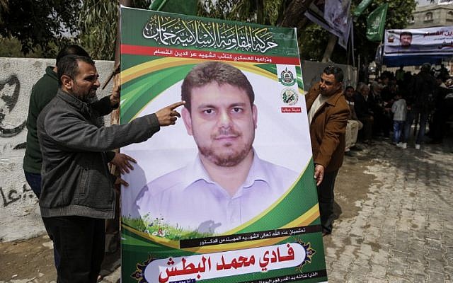 A picture taken on April 21, 2018 shows men holding up a poster portrait of 35-year-old Palestinian professor and Hamas member Fadi Mohammad al-Batsh who was killed early in the day in Malaysia outside his family’s house in Jabalia in the northern Gaza strip. Malaysian police said that the research scientist, who specialised in energy issues, was killed in a drive-by motorcycle shooting as he headed on foot to take part in dawn Muslim prayers on April 21 in Kuala Lumpur.
His family accused Israel’s Mossad spy agency of killing him.
MAHMUD HAMS / AFP