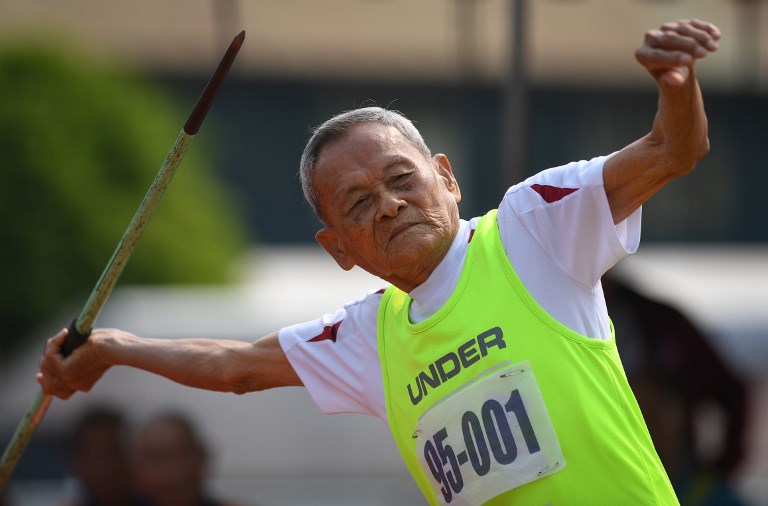 This photo taken on April 25, 2018 shows Sawang Janpram, 98, competing in the javelin during Thailand’s first national Elderly Games in the northern Thai province of Nan. Photo: Lillian Suwanrumpha/ AFP