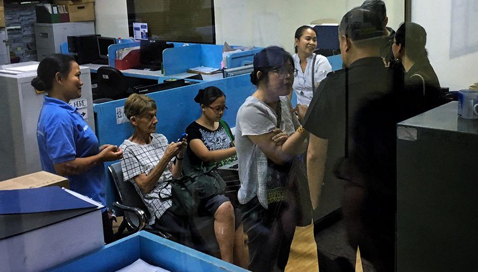 Sister Patricia Fox (second from the left) of the Notre Dame de Sion sisters, an Australian rural missionary and volunteer staff of Unyon ng mga Manggagawa sa Agrikultura (UMA), was taken into custody by immigration officers on Monday, April 16, 2018 at around 2 p.m. from her residence in Quezon City. She is being held at the Intelligence Unit of the Bureau of Immigration “for joining rallies”. The nun recently joined the International Fact-Finding and Solidarity Mission in Mindanao which investigated the human rights situation under martial law. (Photo by Mark Saludes of ABS-CBN News)