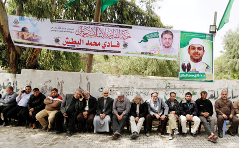 Palestinians gather in mourning outside the family home of 35-year-old professor and Hamas member Fadi Mohammad al-Batsh, who was killed early in the day in Malaysia, in Jabalia in the northern Gaza strip on April 21, 2018. Malaysian police said that the research scientist, who specialised in energy issues, was killed in a drive-by motorcycle shooting as he headed on foot to take part in dawn Muslim prayers on April 21 in Kuala Lumpur.
His family accused Israel’s Mossad spy agency of killing him.
MAHMUD HAMS / AFP