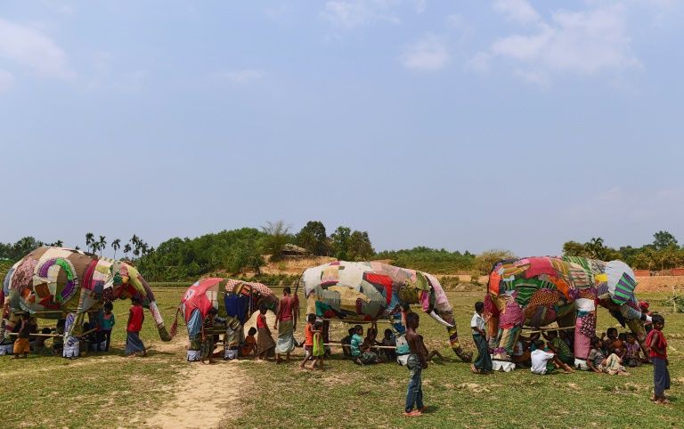 This photograph taken on April 7, 2018 shows Rohingya refugee children playing with mock elephants after a demonstration of elephant resistance arranged by the UNHCR and IUCN at the Kutupalong refugee camp in Ukhia. The purpose of the training day is sobering – a dozen Rohingya have been killed by wild elephants whose habitat has been consumed by Kutupalong refugee camp.
MUNIR UZ ZAMAN / AFP