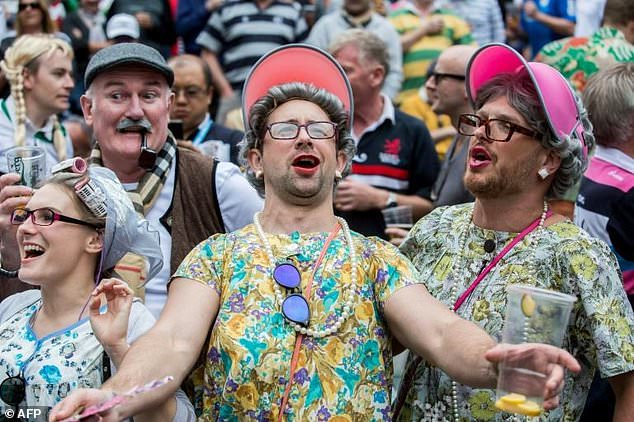 Fans attend the second day of the Hong Kong rugby sevens tournament in Hong Kong on April 7, 2018. 
Isaac LAWRENCE / AFP