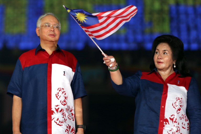 File photo taken on August 31, 2012 shows Malaysia’s then-Prime Minister Najib Razak looking on as his wife Rosmah Mansor waves the Malaysia national flag during a rally to celebrate the country’s 55th Independence Day.
Photo: Mohd Rasfan / AFP