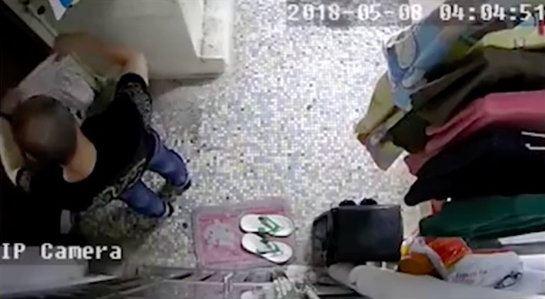 A mystery man was caught on CCTV stealing women’s underwear from a laundry rack in To Kwa Wan. Screengrab via Apple Daily video.