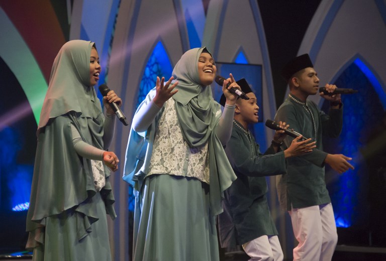 This photograph taken on May 26, 2018 shows high school teens performing live on the television show “Syiar Anak Negeri” in Jakarta. Part talent show and part sermon, the show Syiar Anak Negeri (The Country’s Children Preach) is one of a string of similar programs played during Ramadan that feature kids as young as three competing for TV stardom.AFP/Bay Ismoyo