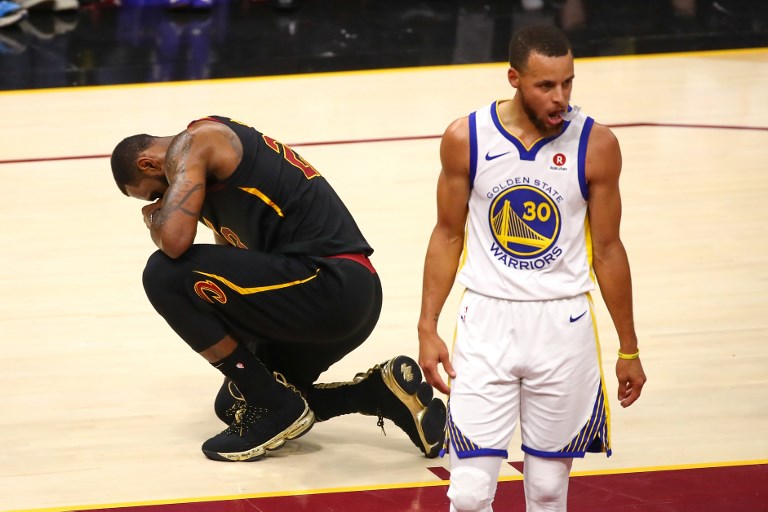 LeBron James #23 of the Cleveland Cavaliers reacts against Stephen Curry #30 of the Golden State Warriors during Game Four of the 2018 NBA Finals at Quicken Loans Arena on June 8, 2018 in Cleveland, Ohio. (Photo via AFP)