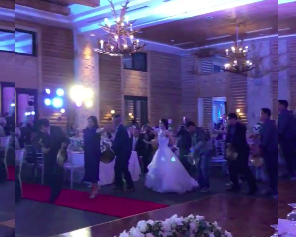 Wedding guests dance the torayan, an Igorot traditional dance. Screenshot via Kevin Narciso’s Twitter.