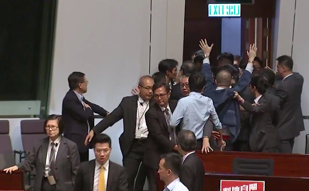 Lam Cheuk-ting is carried out of the Legislative Council. Screengrab via YouTube.