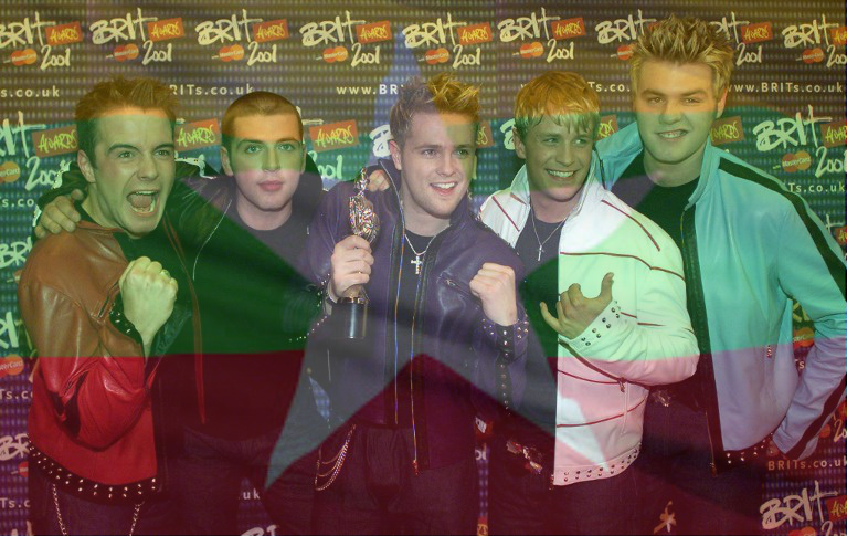 Pop stars Westlife pose for photographers with their award for the Best Pop Act award during The Brit Awards 2001 at Earls Court in London , 26 February 2001. AFP PHOTO  POOL REUTERS/KIERAN DOHERTY/WPA / AFP PHOTO / POOL / KIERAN DOHERTY