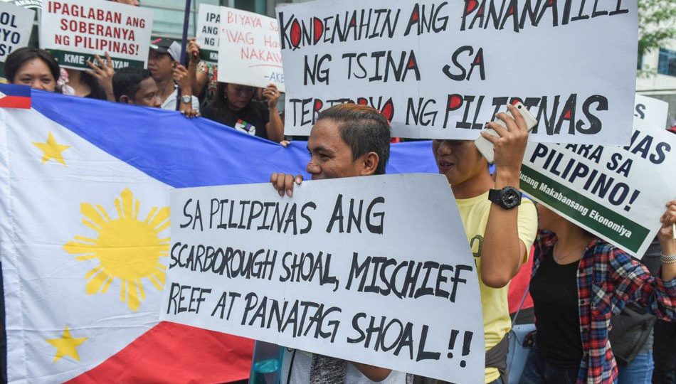 Filipino activists march towards the Chinese embassy in Manila to protest against China’s construction in the disputed areas in the West Philippine Sea. Photo via ABS-CBN.