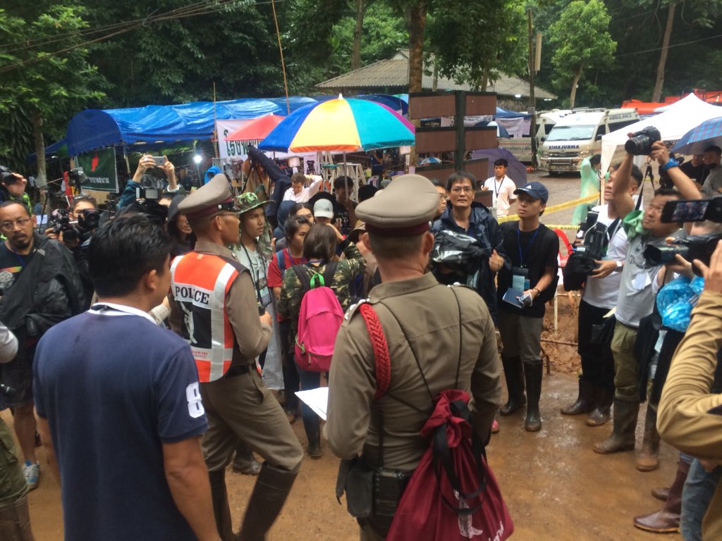 Police told reporters to leave the rescue site. Photo: Thai News Agency/ Twitter