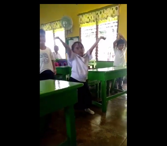 This dancing girl brings a lot of extra in her routine. Screenshot from the video.