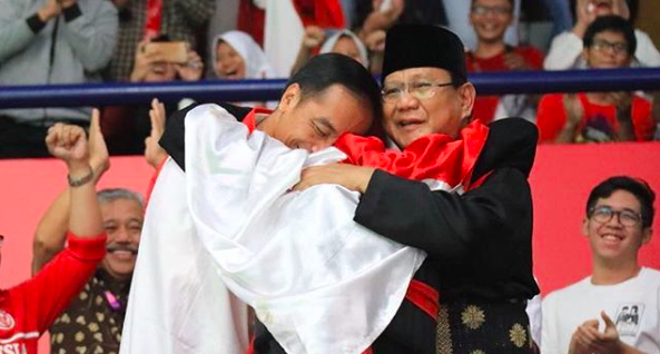 President Joko Widodo (L) and his challenger in the 2019 election Prabowo Subianto hugging pencak silat gold medalist Hanifan Yudani Kusumah after the martial artist’s victory at the 2018 Asian Games. Photo: Instagram/@prabowo 