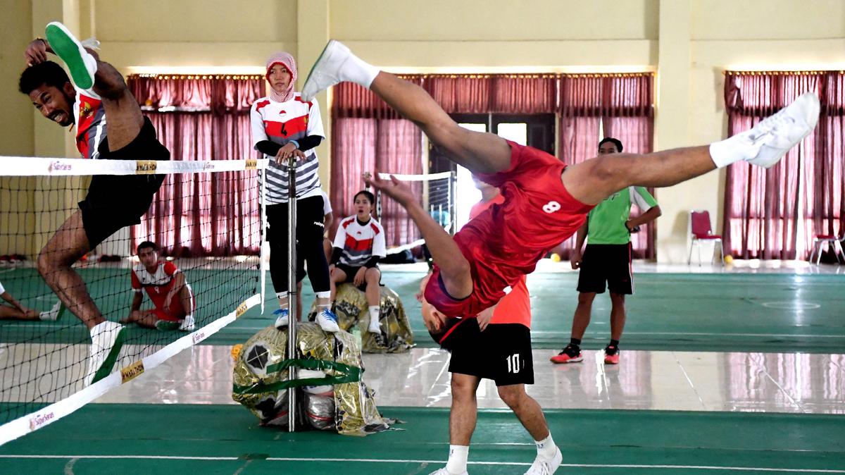This photo taken on May 22, 2017 shows a member of Indonesia’s national sepak takraw team performing an overhead kick to fire a ball over the net during a training session at an elite police force base in Jambi. The sport, which combines elements of football and volleyball, is native to Southeast Asia but the region’s biggest country has long lagged behind its smaller neighbours in the battle for dominance.
GOH Chai Hin / AFP