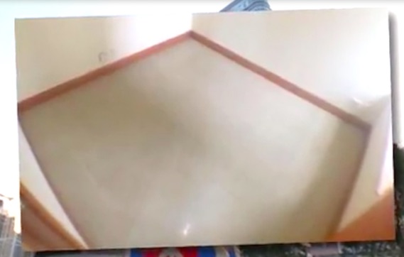 Is this the city’s most expensive shoebox room? Screengrab via Apple Daily video.