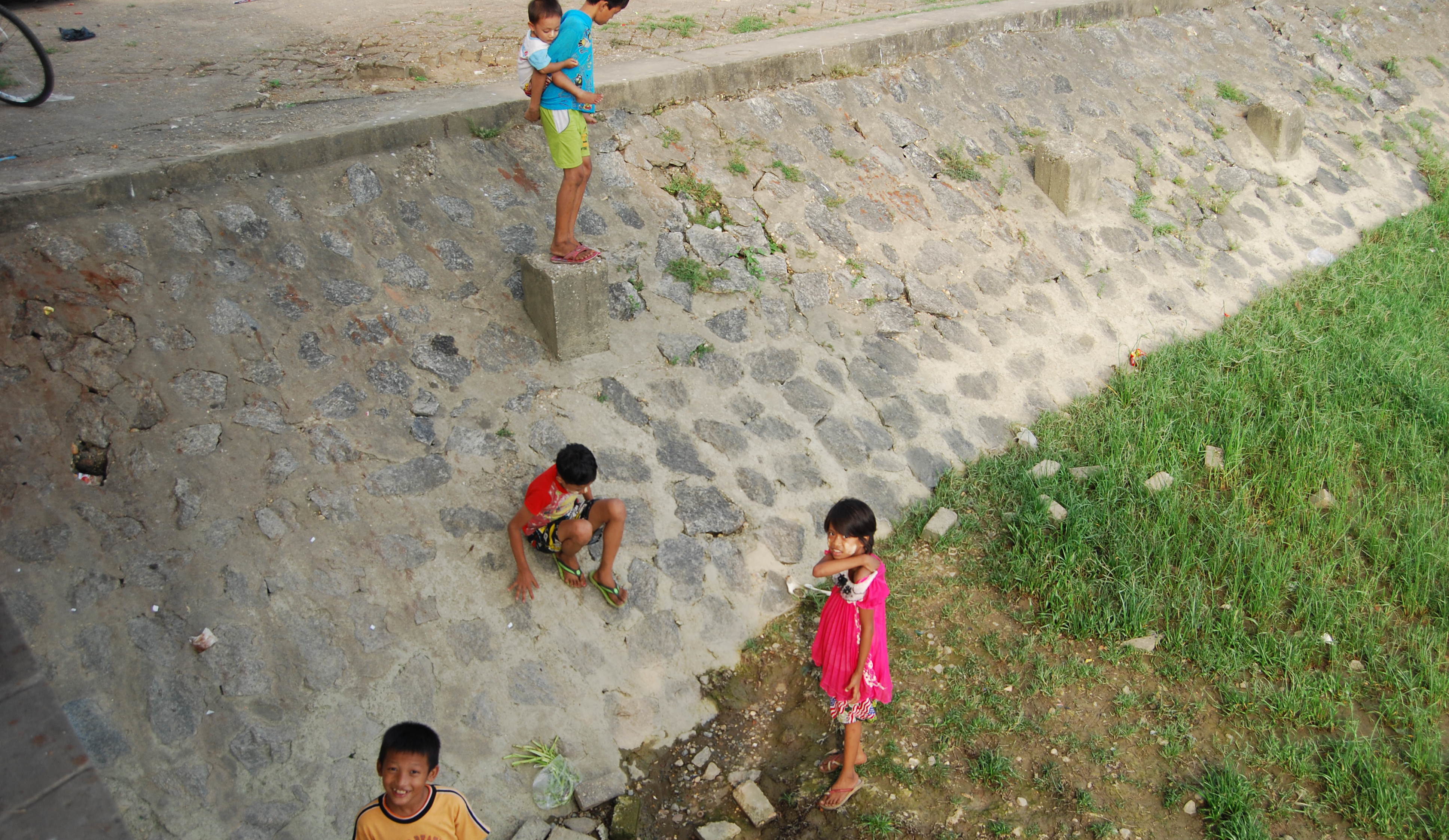 Children by the Yangon River.
