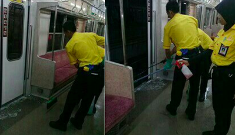 Jakarta’s KRL Commuterline cleaners cleaning a carriage where a woman allegedly pooped her pants. Photo: Twitter / @CommuterLine
