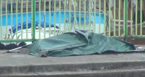 Bodybag containing the body of the middle-aged man found in the sea. Screengrab via Apple Daily video.