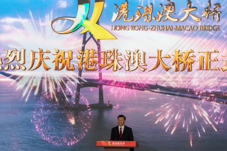 China’s President Xi Jinping attends the opening ceremony of the Hong Kong-Zhuhai-Macau Bridge at the Zhuhai Port terminal on October 23, 2018. – China’s President Xi Jinping launched the world’s longest sea bridge connecting Hong Kong, Macau and mainland China on October 23 at a time when Beijing is tightening its grip on its semi-autonomous territories. (Photo by FRED DUFOUR / AFP)