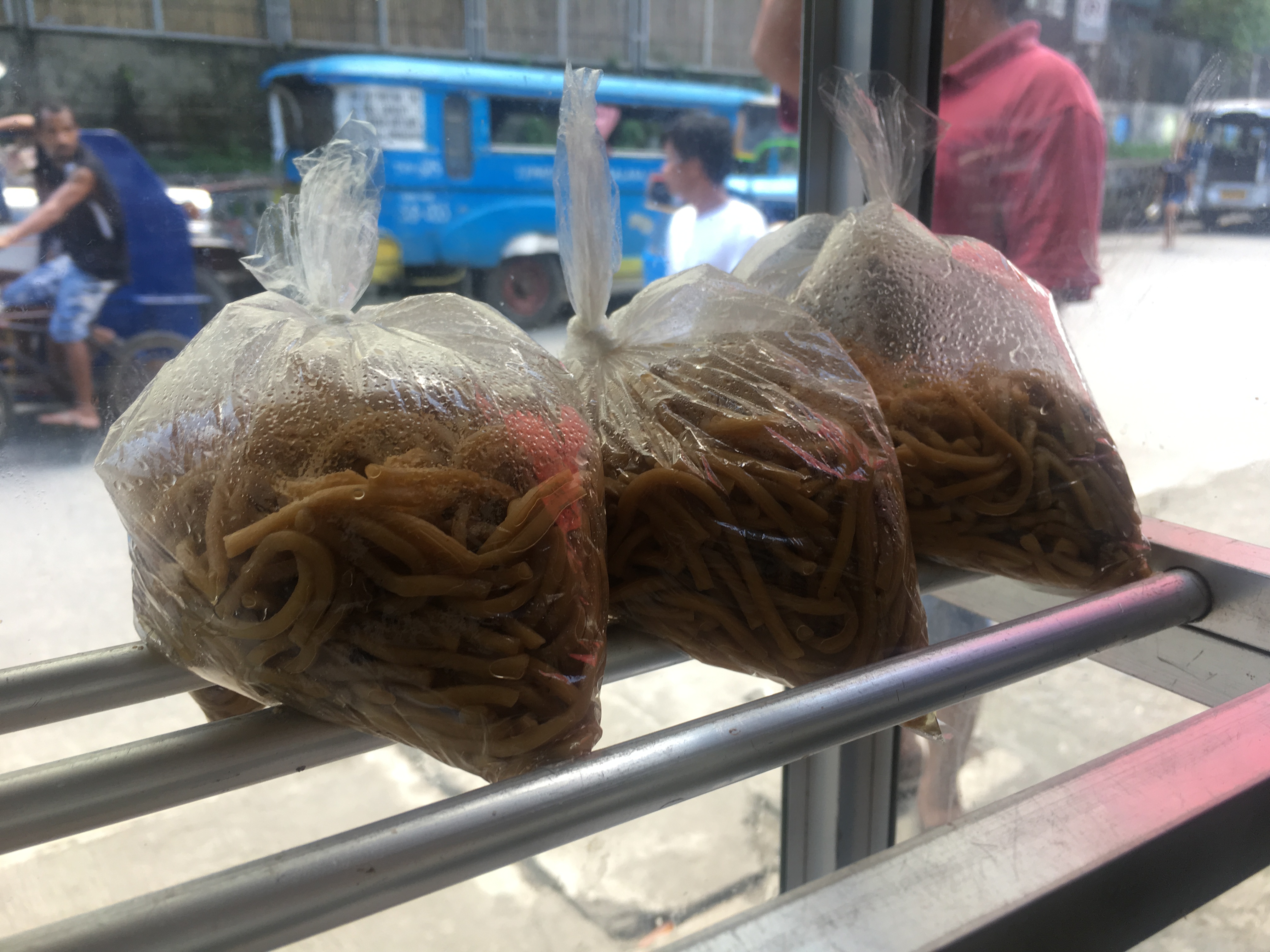 Pancit in disposable plastic bags. (Photo: Therese Reyes) 