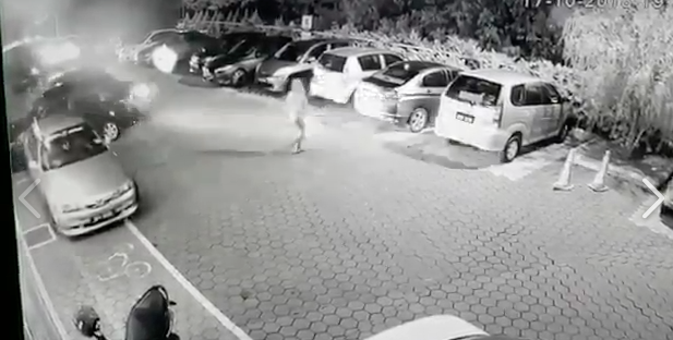 A screenshot of the victim running from the vehicle 