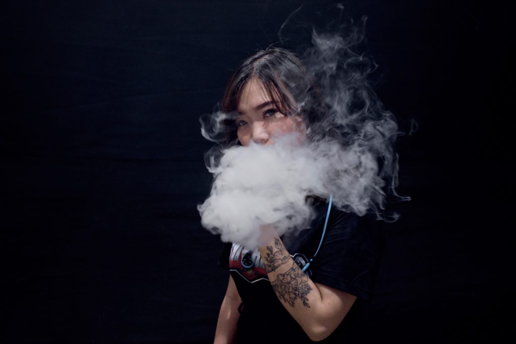 Debora Chen, 26, poses for a photo after competing in vape cloud trick competition during the 2018 Vape Fair in Jakarta, Indonesia, 8 September 2018. Photo: Reynold Sumayku
