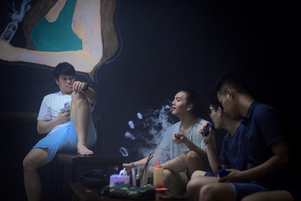 Young men enjoying flavored vapors inside a vape shop and cafe in Tangerang, Banten province, Indonesia. Photo: Reynold Sumayku