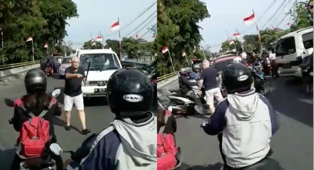 A foreigner spotted conducting traffic in Bali. Still from viral Facebook footage via Agung Kresna