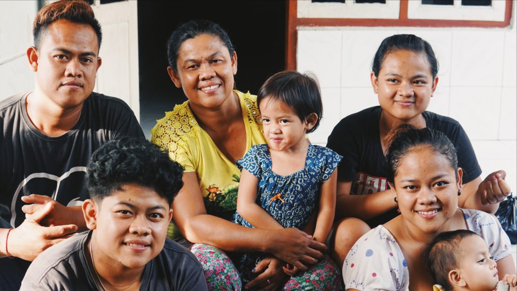 Pindu, a deaf resident of Bengkala (center) and her family. Photo: Coconuts Bali