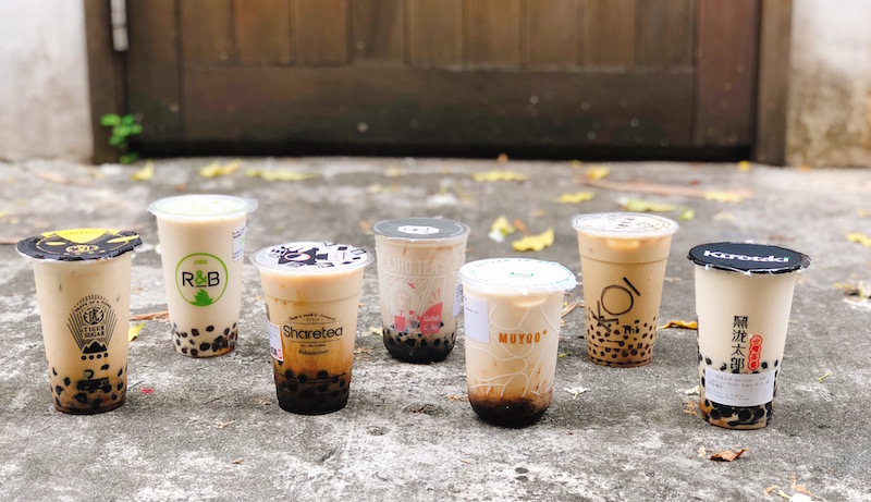 The 7 variations of brown sugar pearl milk, sadly with their syrupy “stains” gone after traveling the distance to our office. Photo: Coconuts Media