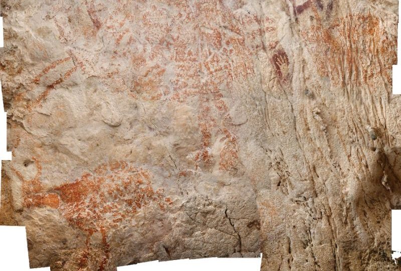 The painting in Borneo, possibly depicting a native type of wild cattle, is among thousands of artworks discovered decades ago in the remote region (AFP Photo/Luc-Henri FAGE/KALIMANTHROPE.COM)